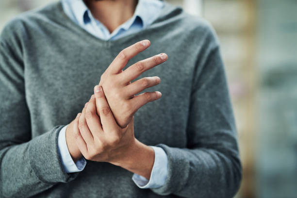 Carpal tunnel syndrome can be a pain Cropped shot of an unidentifiable businessman experiencing discomfort in his hands knuckle joint stock pictures, royalty-free photos & images