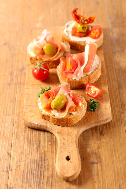 istock tapas, canape with cheese and ham 1140572391