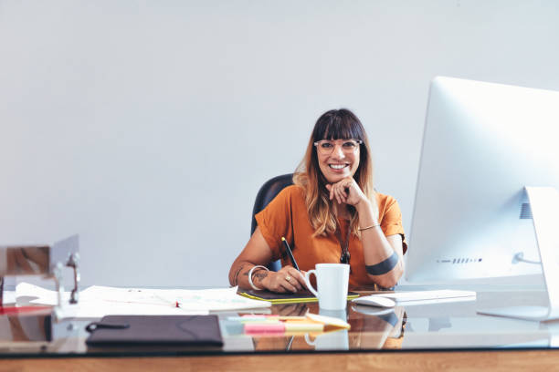 istock Illustrator working on her drawings at office 1140573455