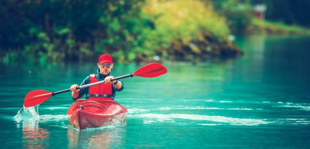 Kayaker having fun in white water rapids,  with copy space