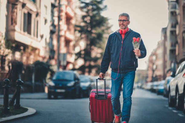istock businessman with suitcase walking  in a city. 1140573954