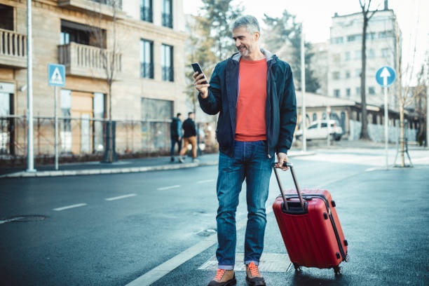 istock businessman with suitcase walking  in a city. 1140574017