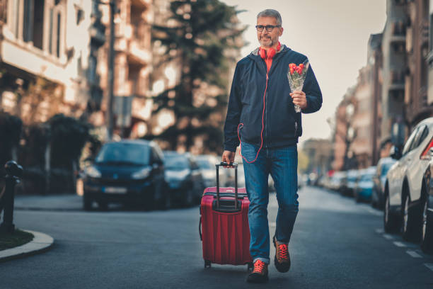 istock businessman with suitcase walking  in a city. 1140574099