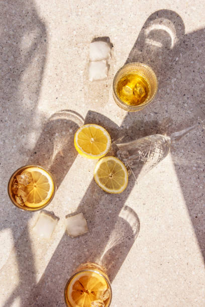 istock Refreshment drinks on astone table . Summer tropical mood with artistic geometric shadows. 1140574205