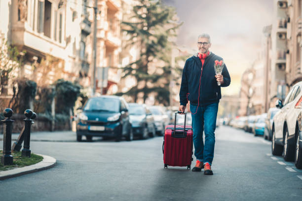 istock businessman with suitcase walking  in a city. 1140574805