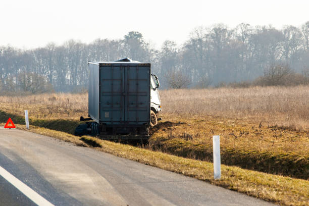 istock truck accident crashed out of the way into a ditch 1140575456