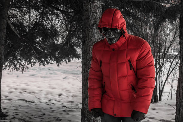 istock Man in death mask in the park 1140578684
