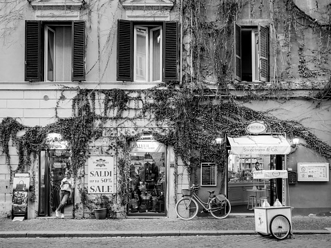 Rome, Italy, Oct 20 - Be a bicycle in Rome. A bicycle rests between an ice cream shop and fashion shops along Borgo Pio, an ancient and small Roman neighborhood built since the Middle Ages near St. Peter's Square.