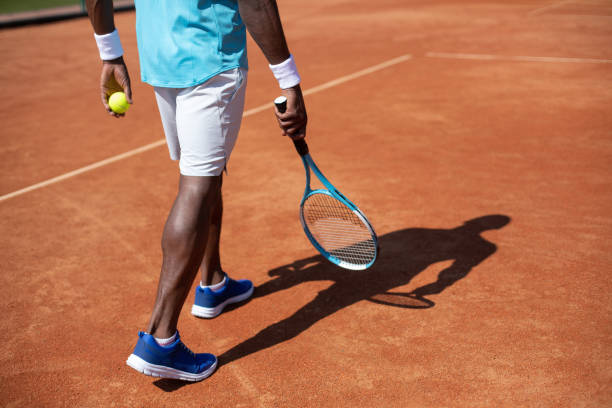 istock Man is having tennis game in open air 1140580670