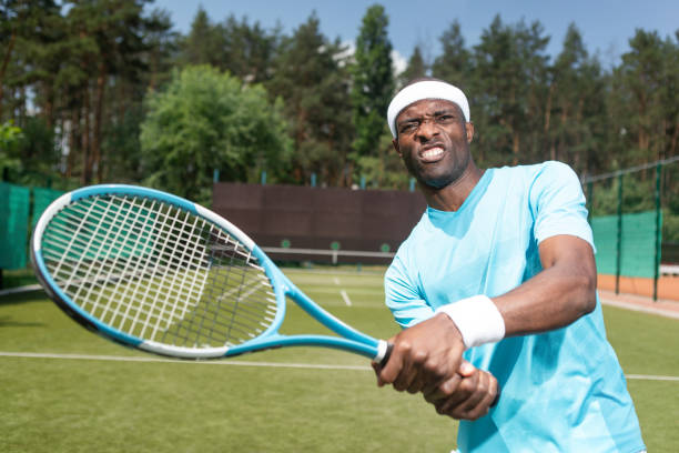 istock Strained man is receiving ball during tennis set 1140580881