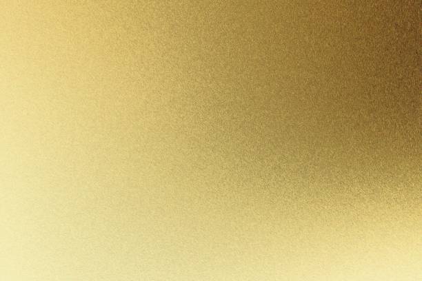 istock Abstract texture background, light shining on rough golden metal wall 1140581965