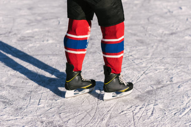istock hockey skates close-up during a game on ice 1140582272