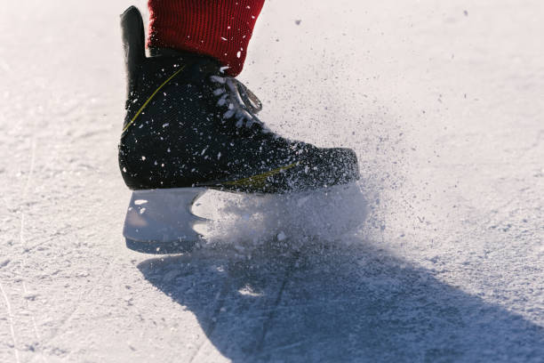 istock hockey skates close-up during a game on ice 1140583421