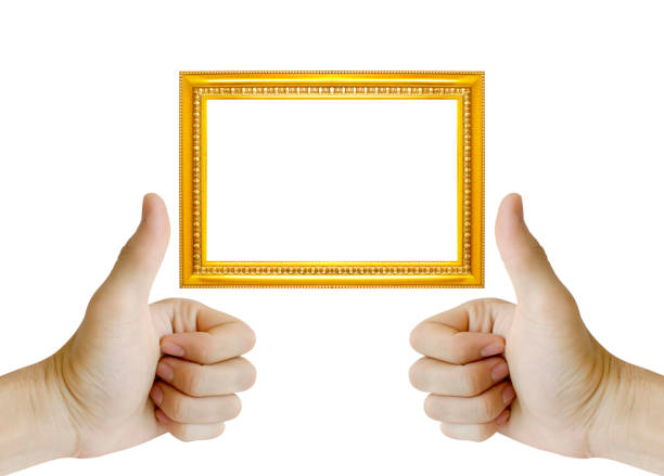 istock Hand gesturing the ok sign and golden frame isolated on white background 1140583433