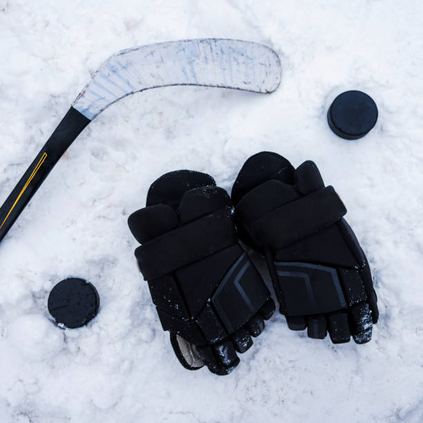 istock hockey player lying on the snow at the stadium 1140583531