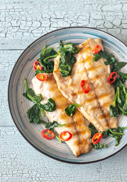 istock Grilled sea bream fish fillet with spinach 1140589185
