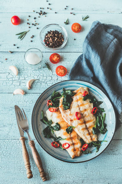 istock Grilled sea bream fish fillet with spinach 1140589254