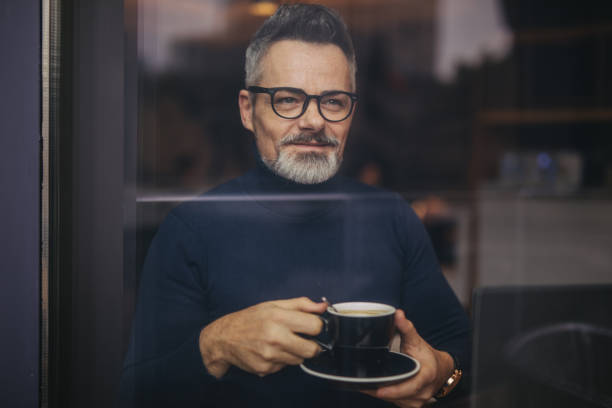 istock Mature man in the coffee shop 1140589297