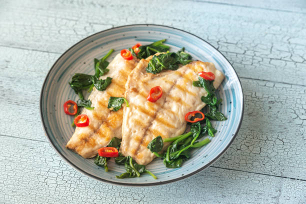 istock Grilled sea bream fish fillet with spinach 1140589317