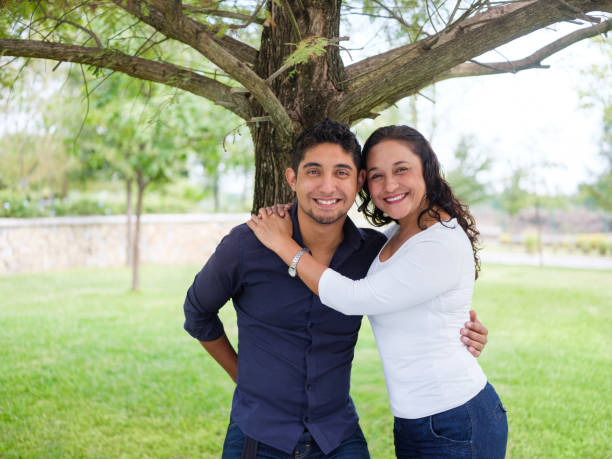 istock Happy young latin man and mother smiling at camera 1140590651
