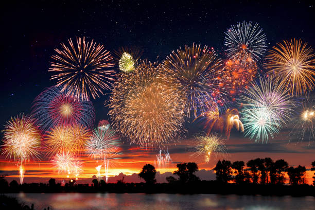Fireworks at the lake during party event or wedding reception Fireworks at the lake during party event or wedding reception july photos stock pictures, royalty-free photos & images