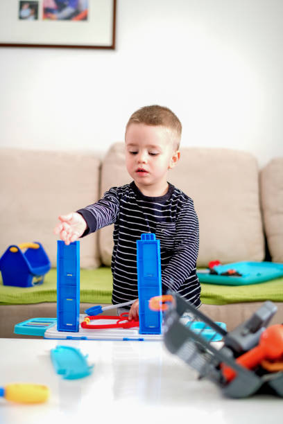 istock Little boy playing with toys 1140592710
