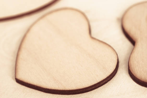 istock wooden heart on wooden background texture macro 1140597023