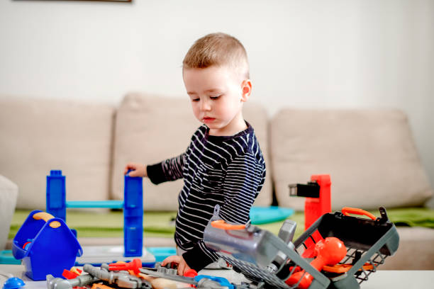 istock Little boy playing with toys 1140597080