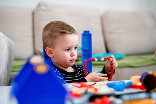 istock Little boy playing with toys 1140597825
