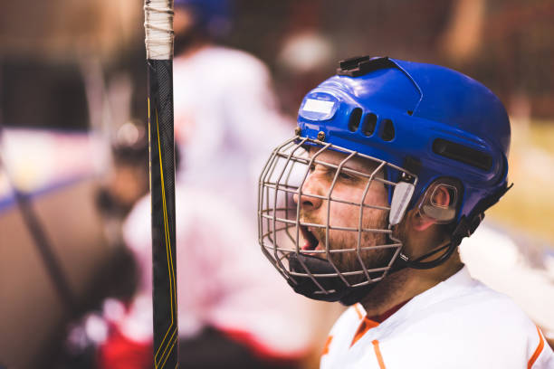 istock hockey player keeps shouting his team sitting on the bench 1140601113