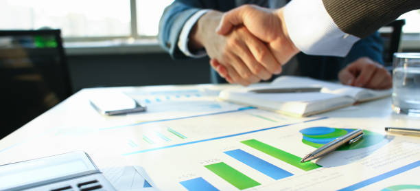 istock Businessman in sut hand shake in ofiice closeup 1140602373