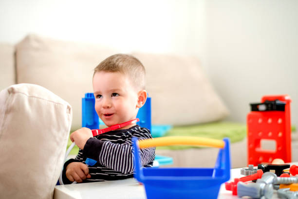istock Little boy playing with toys 1140604954