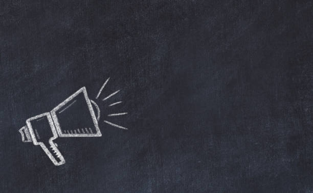 Black chalkboard with sketch of loudspeaker and copy space. stock photo