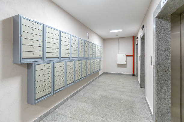 Elevators and mailboxes at the entrance of residential apartment-house stock photo