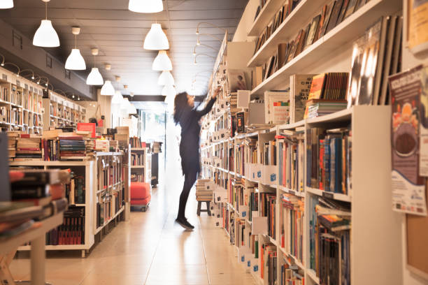 istock Organizing the shelf in the bookstore 1140610268