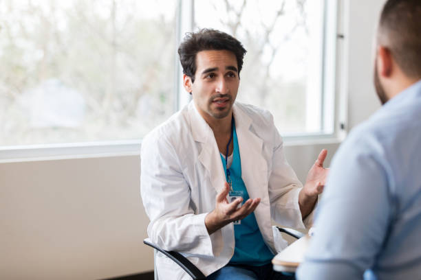 istock Doctor discusses something with patient 1140610948