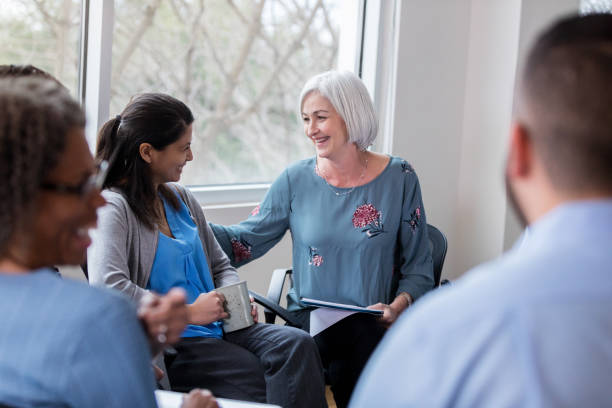 istock Business executive commends employee during meeting 1140610978