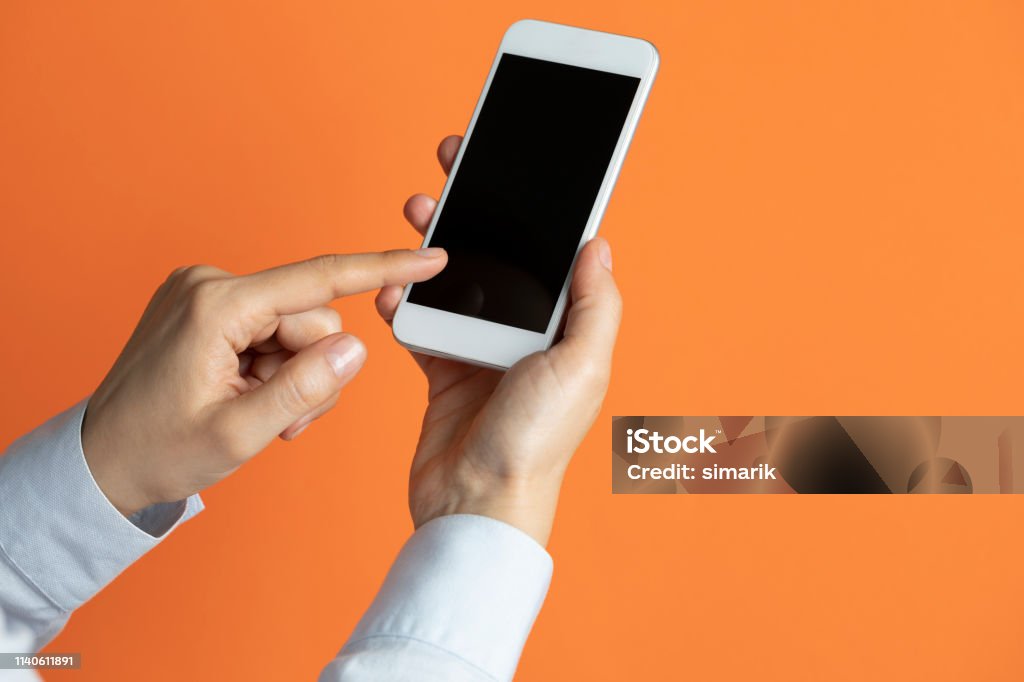 Using Using Phone Background Image Using Phone Stock Photo - Download Image Now - Orange Color, Telephone ...