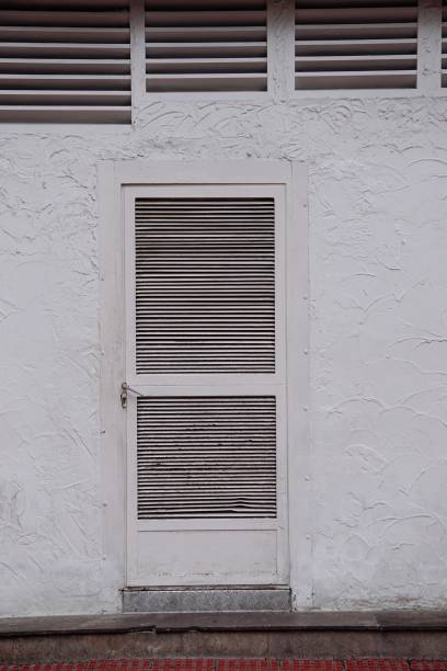 istock door on the wall in the building 1140614021