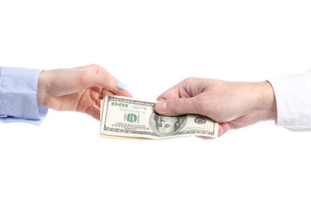 istock Hand give money dollars to hand 1140615319