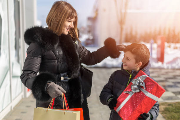 istock Happy mother and son shopping together 1140617074