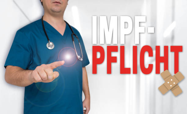 istock Impfpflicht (in german Vaccination) concept is shown by doctor 1140617102