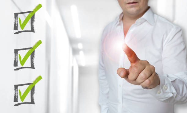 istock Checklist touchscreen concept is operated by man 1140617402
