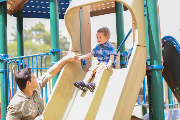istock Little boy, father playing at local park. 1140619988