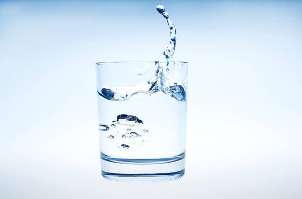 istock water splashing from glass isolated on white background 1140620566