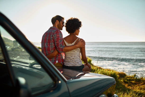 istock Couple enjoying road trip in a convertible car 1140620904