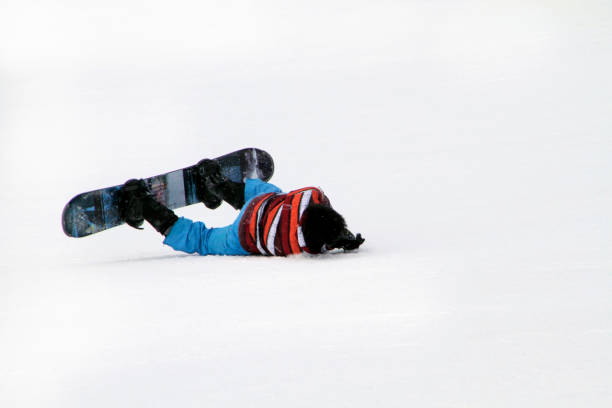 istock Young man on snowboard falling on his face 1140621160