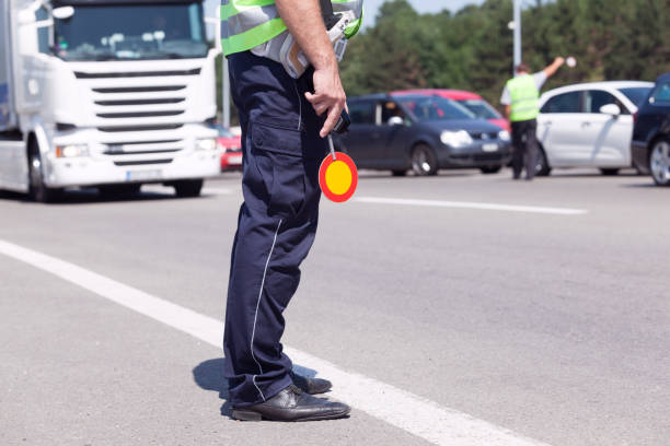 istock Police officer controlling traffic on the highway 1140622250
