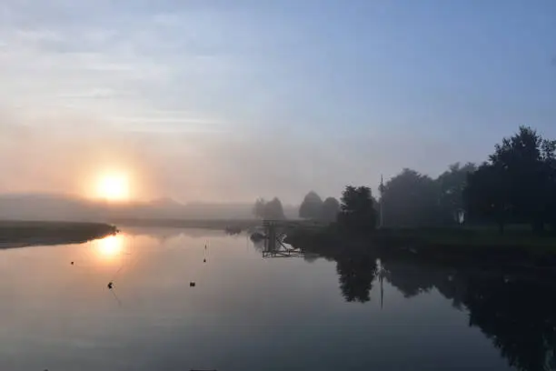 Foggy morning on Duxbury Bay with the sun reflecting.