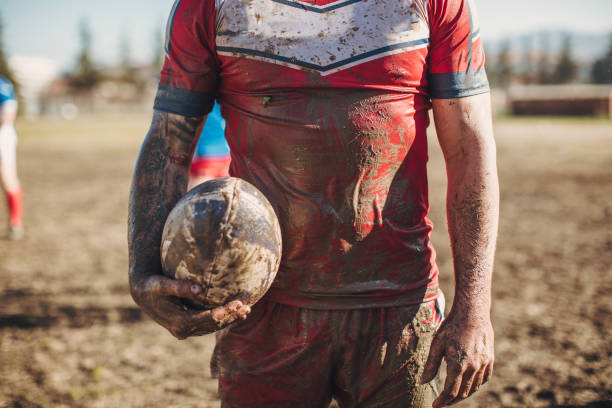 istock Rugby player standing on a playing field with ball 1140623713